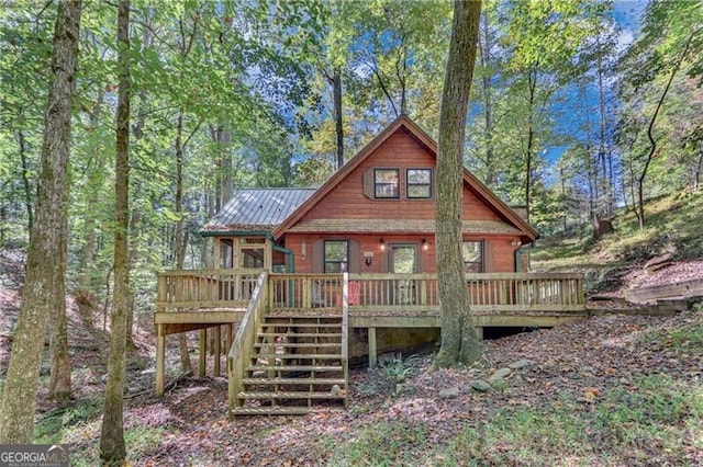 back of house featuring a deck