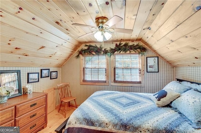 bedroom with light hardwood / wood-style floors, wood ceiling, ceiling fan, and vaulted ceiling