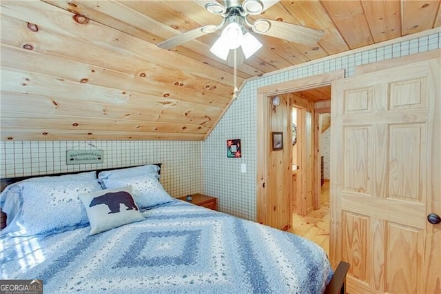 bedroom with wood-type flooring, ceiling fan, wooden ceiling, and vaulted ceiling