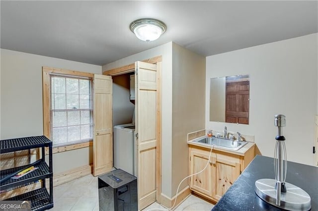 bathroom featuring sink and washer / clothes dryer