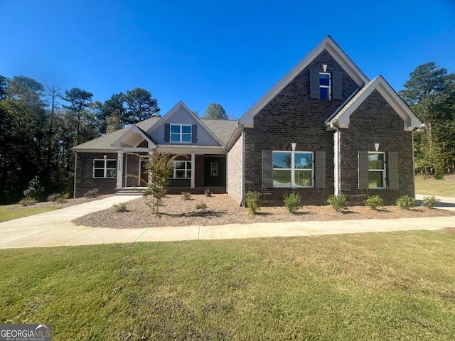 craftsman-style home with a front yard