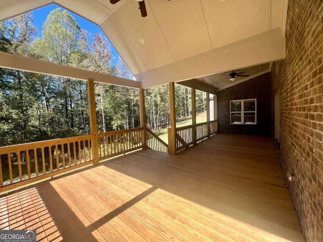 wooden deck featuring ceiling fan