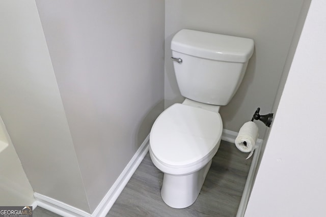 bathroom featuring toilet and hardwood / wood-style floors