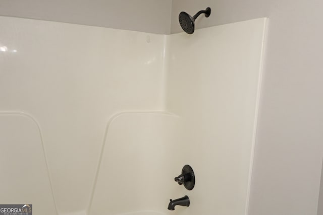 interior details featuring  shower combination