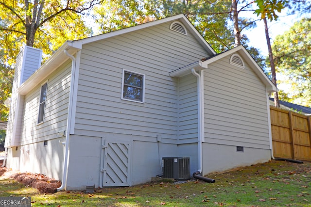 view of side of property with central AC