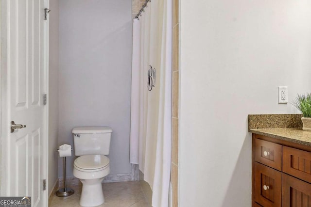 bathroom with vanity, toilet, tile patterned flooring, and a shower with shower curtain