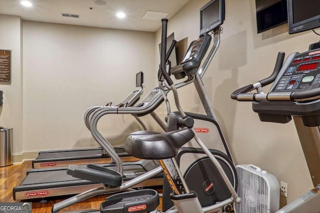 exercise area with hardwood / wood-style floors