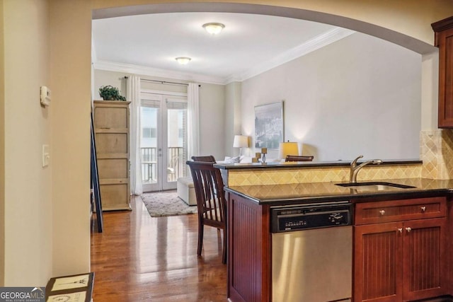 kitchen featuring decorative backsplash, stainless steel dishwasher, ornamental molding, dark wood-type flooring, and sink