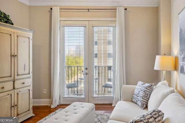 living area with ornamental molding, french doors, and dark hardwood / wood-style floors