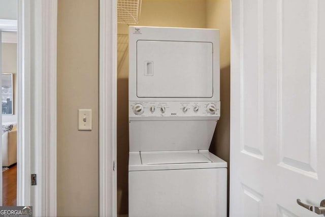 laundry area featuring stacked washer and dryer