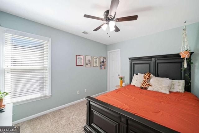 carpeted bedroom with ceiling fan