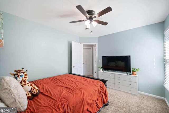 bedroom featuring light carpet and ceiling fan