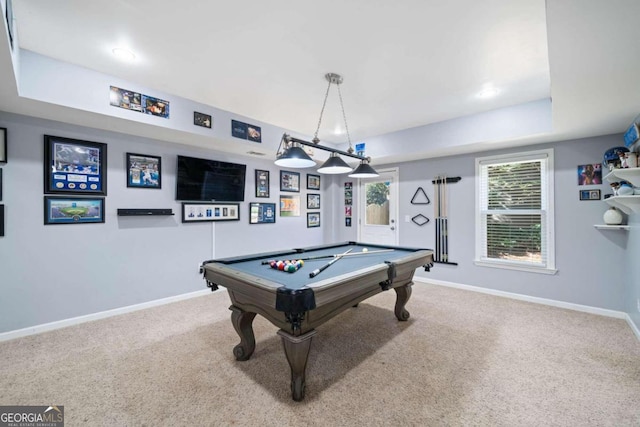 game room with a tray ceiling, carpet, and billiards