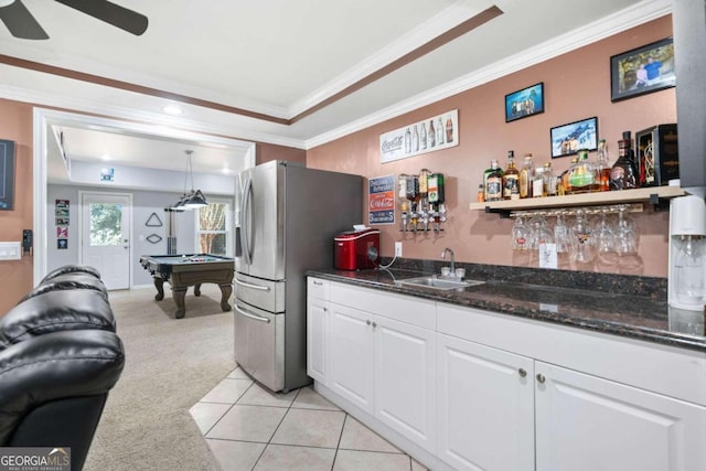 kitchen featuring light carpet, pool table, white cabinetry, stainless steel refrigerator, and sink