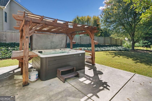 view of patio with a hot tub and a pergola