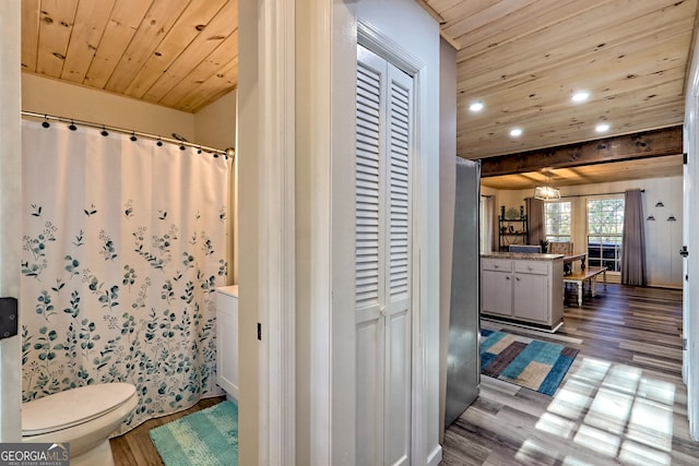 bathroom with vanity, toilet, wood-type flooring, and wood ceiling