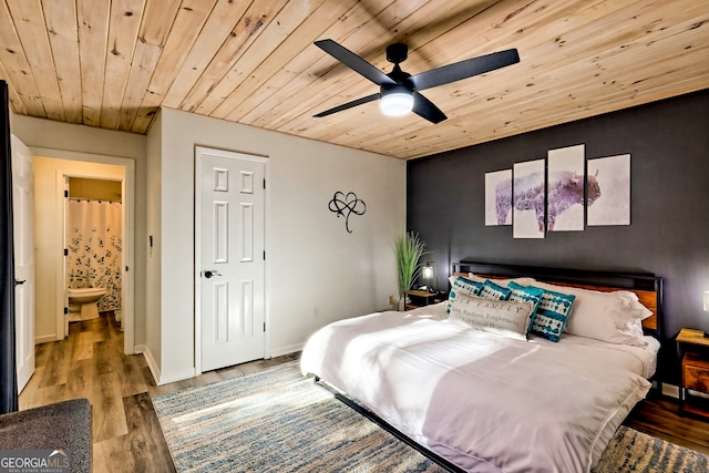 bedroom with hardwood / wood-style floors, ensuite bathroom, wooden ceiling, and ceiling fan