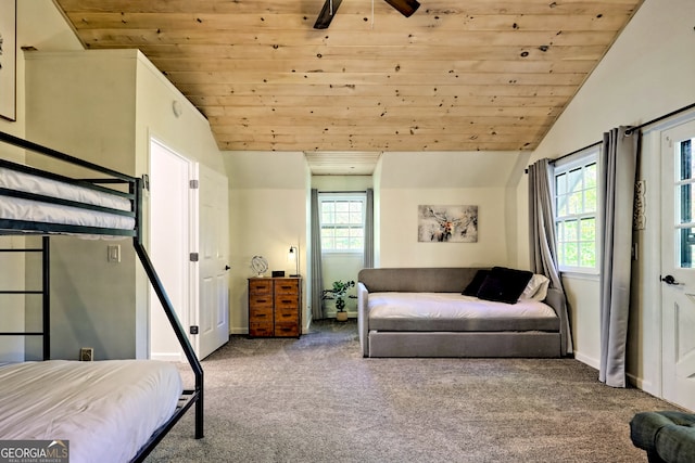 bedroom featuring wood ceiling, carpet floors, lofted ceiling, and ceiling fan