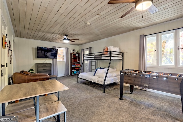 bedroom with wood ceiling, carpet flooring, and ceiling fan