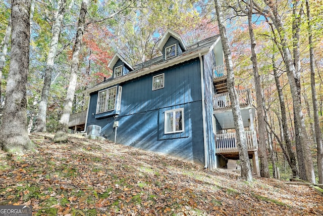 view of home's exterior with a balcony