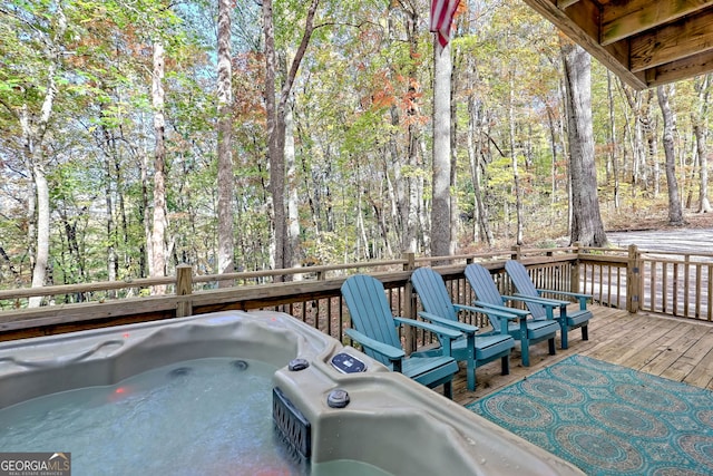 wooden deck with a hot tub