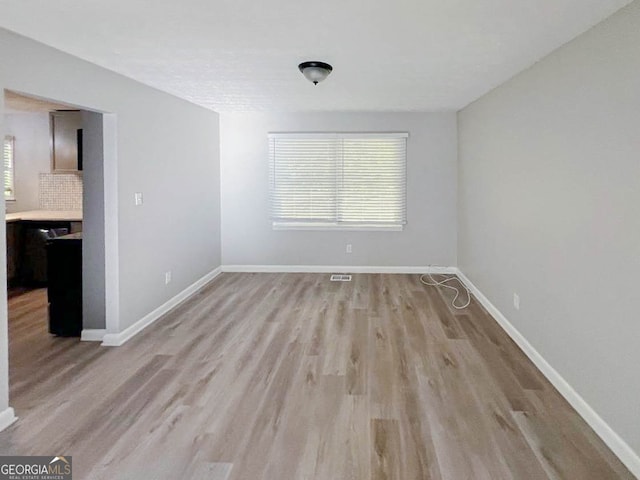 unfurnished dining area featuring light hardwood / wood-style flooring