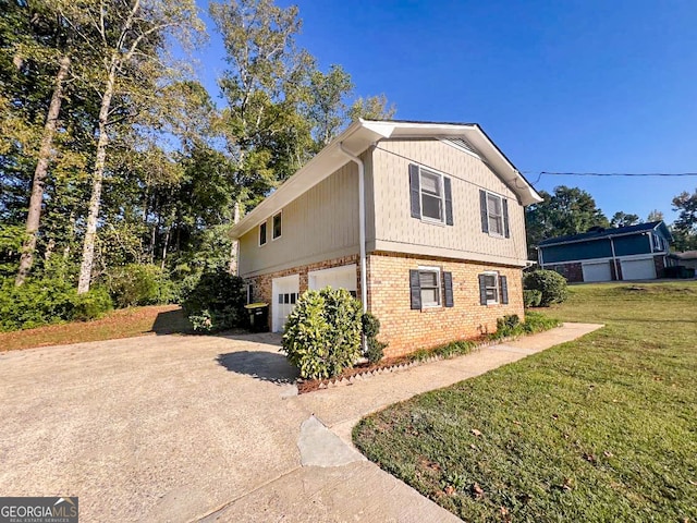 view of home's exterior featuring a garage and a lawn