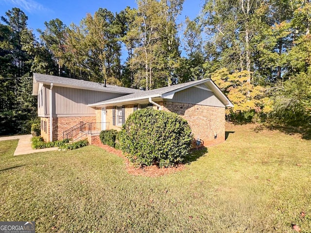 view of property exterior featuring a lawn