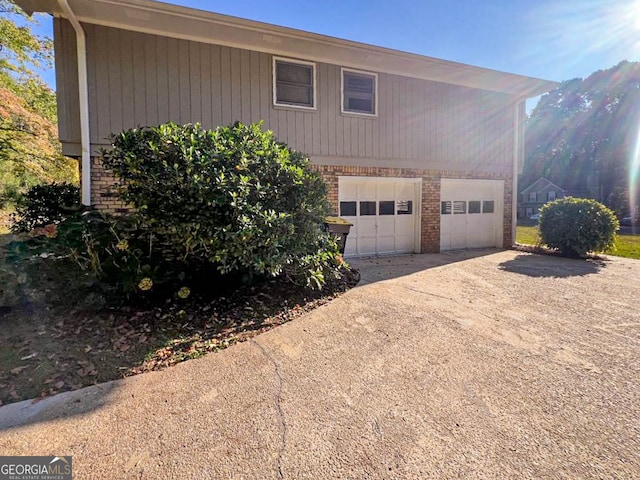 view of side of home featuring a garage