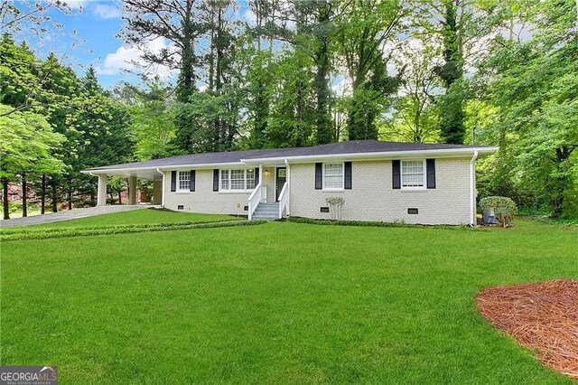 ranch-style home with a front yard