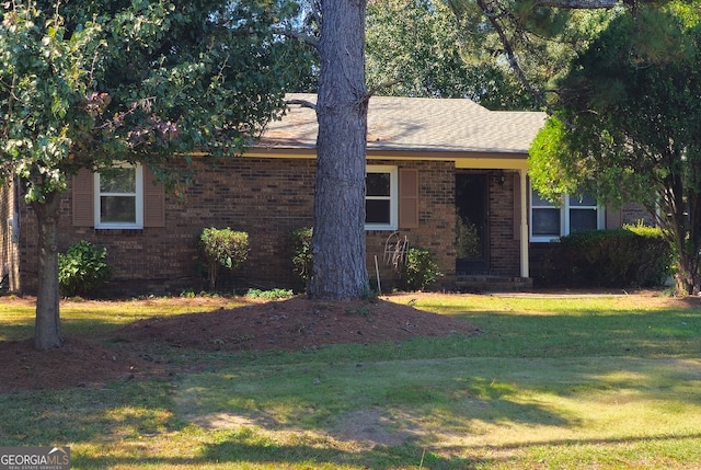 view of front of home with a front lawn