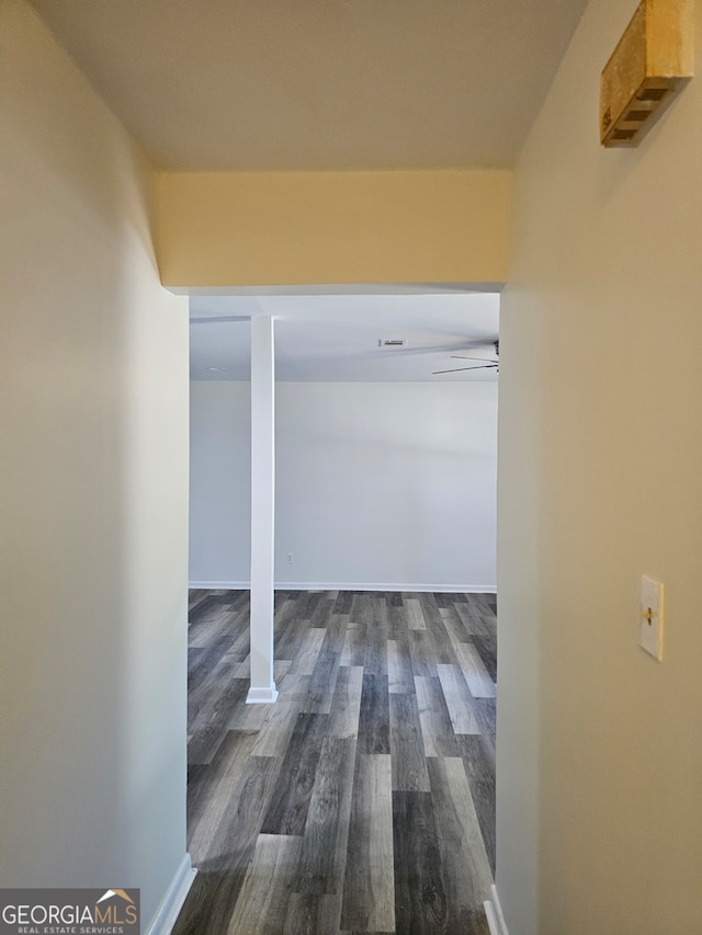 corridor with dark hardwood / wood-style floors