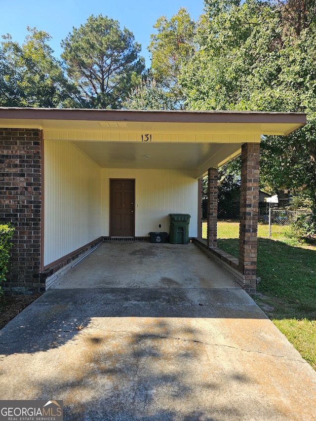 view of vehicle parking with a carport