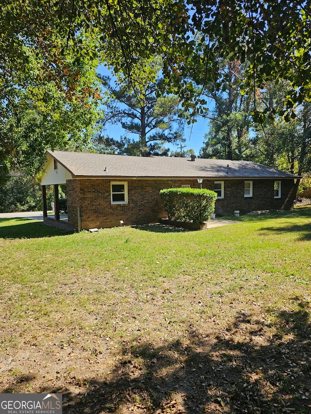 view of home's exterior with a lawn