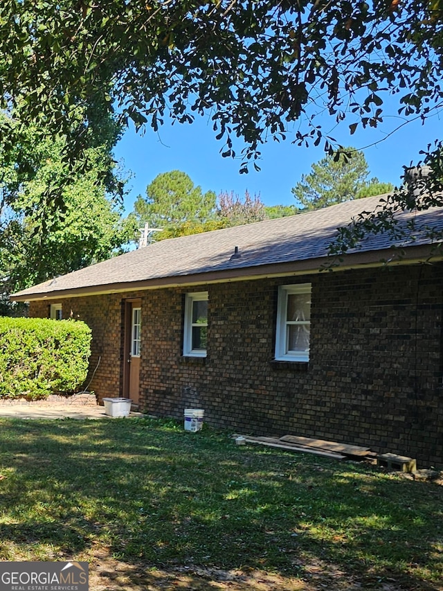 view of home's exterior featuring a lawn