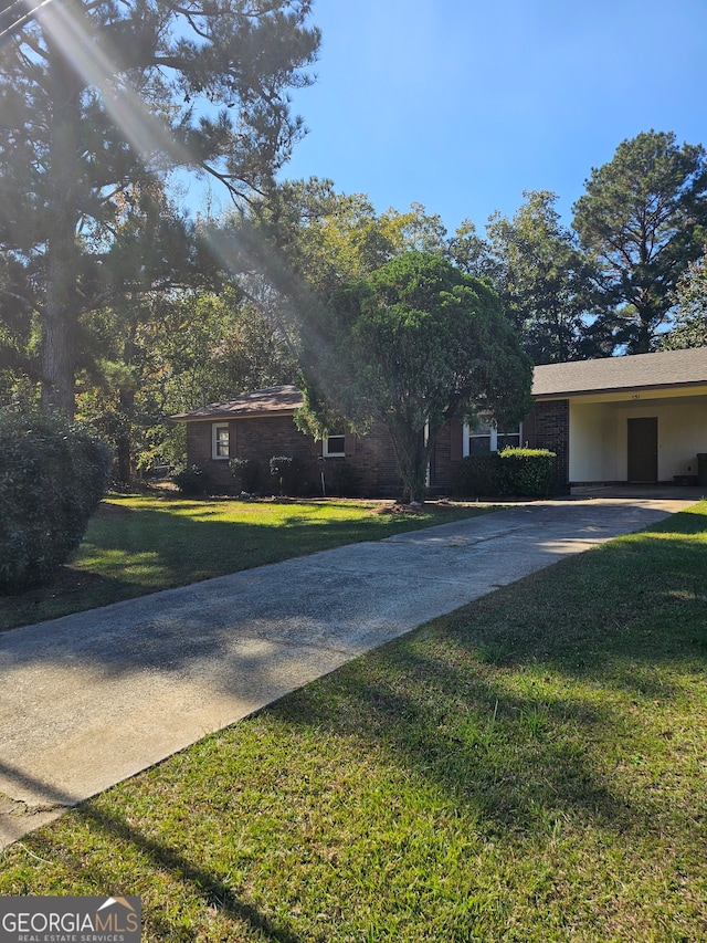 view of property exterior with a lawn