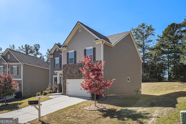 view of front facade with a front yard and a garage