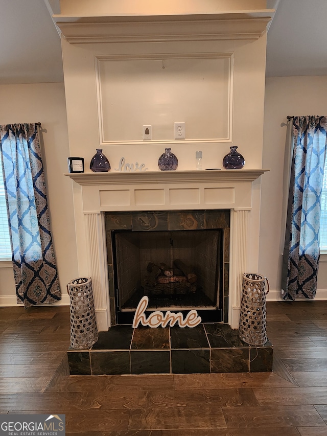 details with wood-type flooring and a fireplace