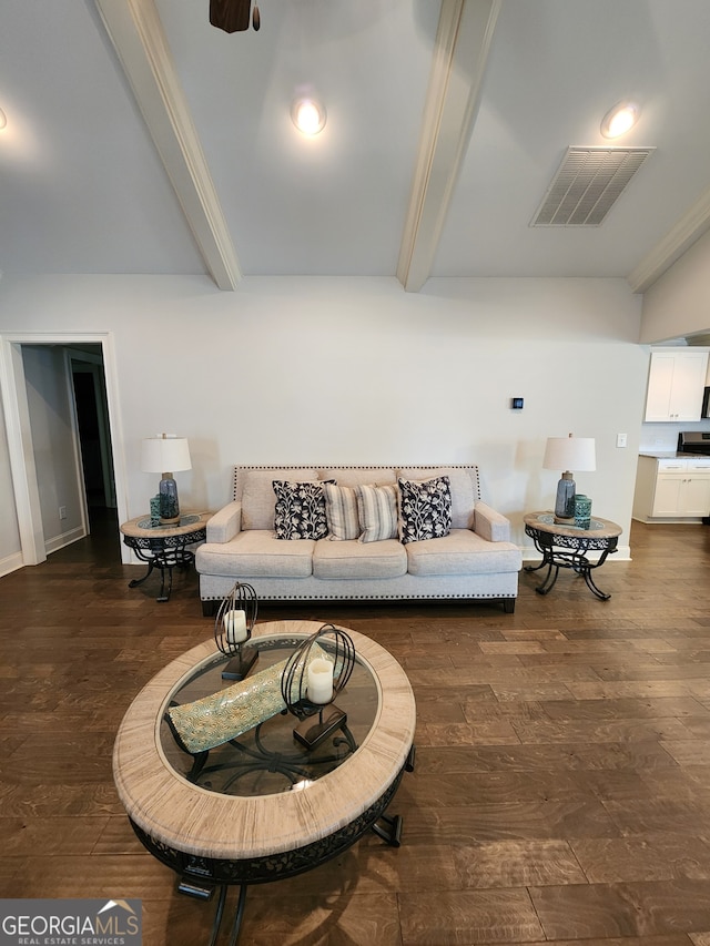 living room with beam ceiling, ornamental molding, dark hardwood / wood-style floors, and ceiling fan