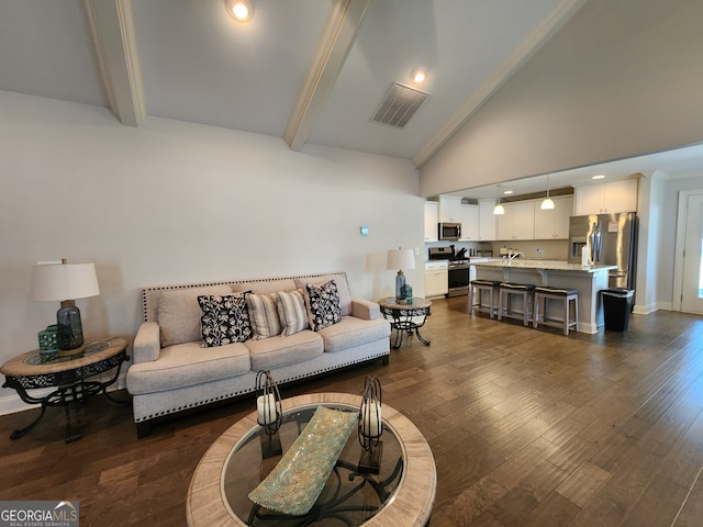 living room with sink, dark hardwood / wood-style flooring, beamed ceiling, crown molding, and high vaulted ceiling