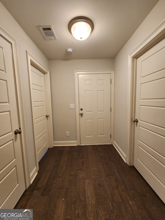 doorway to outside featuring dark hardwood / wood-style flooring