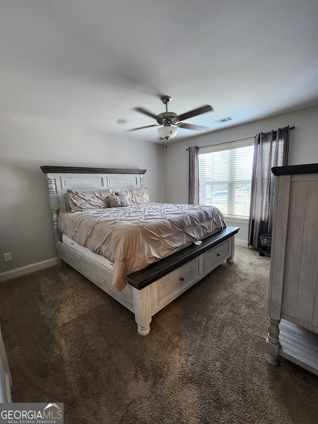 bedroom featuring dark carpet and ceiling fan