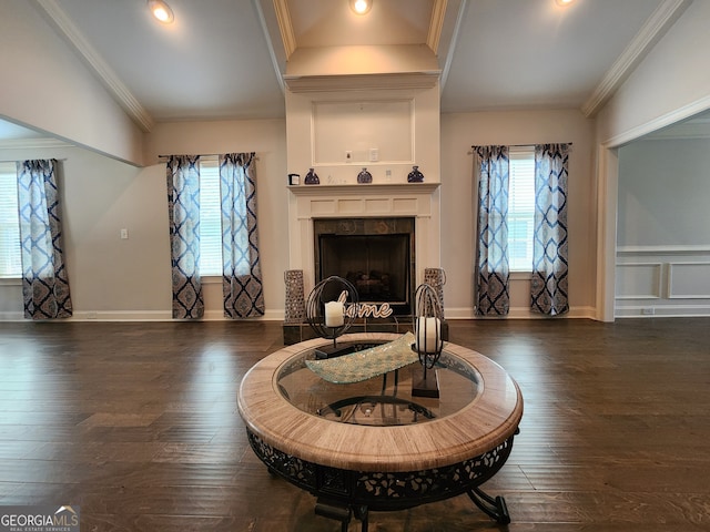 sitting room featuring crown molding, dark hardwood / wood-style flooring, and a fireplace