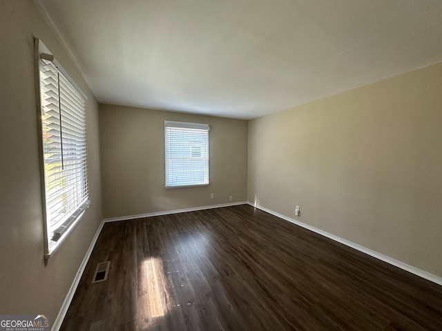 empty room featuring dark hardwood / wood-style floors