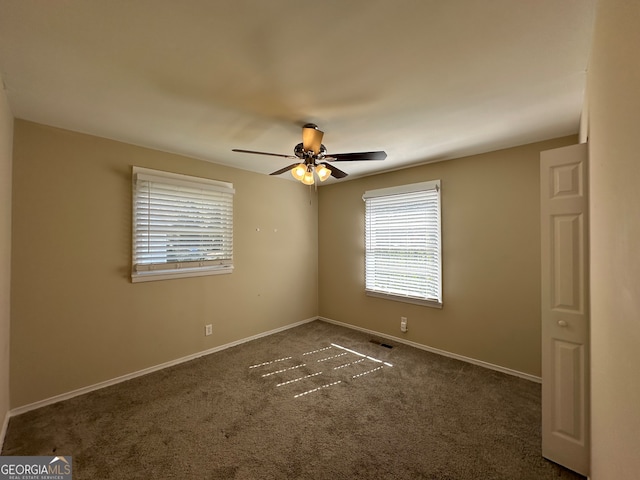 carpeted empty room with ceiling fan