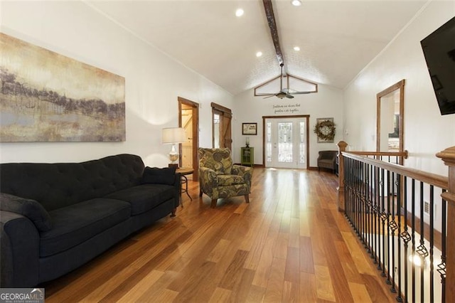 living area featuring french doors, vaulted ceiling with beams, recessed lighting, a ceiling fan, and hardwood / wood-style flooring