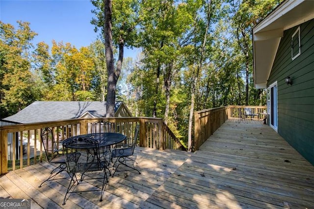 wooden deck with outdoor dining space