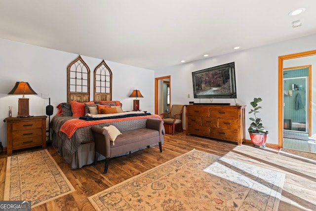 bedroom with hardwood / wood-style floors