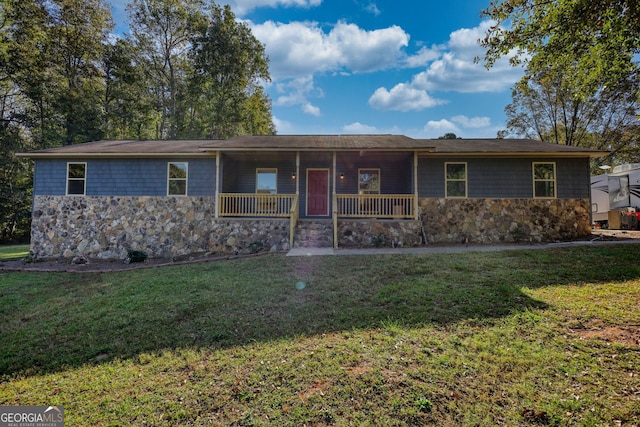 ranch-style house featuring a porch and a front yard