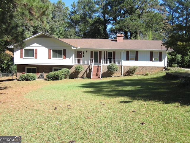 view of front facade with a front yard and a porch